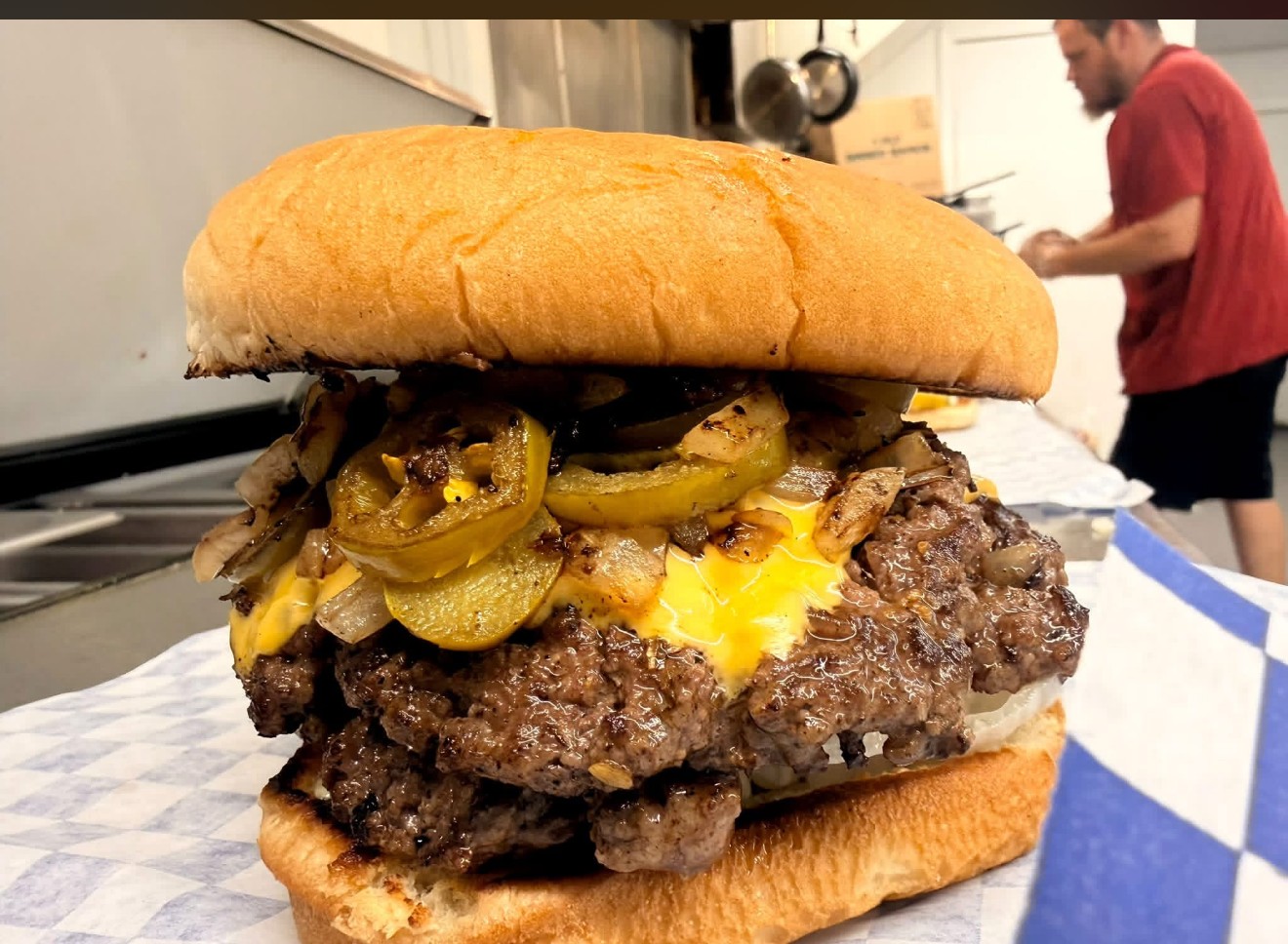 Double cheeseburger with jalapeños and grilled onions at Skipper'z